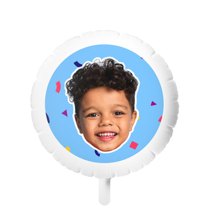 A custom face photo balloon featuring a single-sided white mylar design with a colorful background and a smiling child's face.